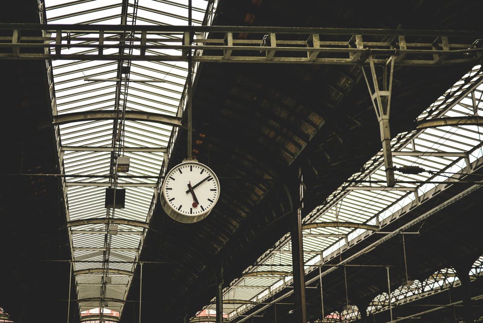 Clock hanging in train station